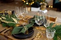 Table served for Christmas dinner in living room, close-up view, table setting, Christmas decoration Royalty Free Stock Photo