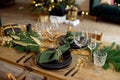 Table served for Christmas dinner in living room, close-up view, table setting, Christmas decoration