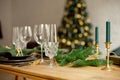 Table served for Christmas dinner in living room, close-up view, table setting, Christmas decoration Royalty Free Stock Photo