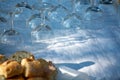 Table served outside in garden with many empty wine glasses for Royalty Free Stock Photo