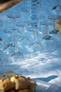 Table served outside in garden with many empty wine glasses for Royalty Free Stock Photo