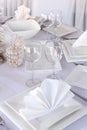 Table served with white square plates and wineglasses Royalty Free Stock Photo