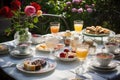 table set for afternoon tea, with delicate cups, pastries and rose garden in the background
