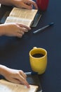 Table Set for a Bible Study as People Search the Scriptures