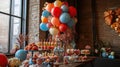 Table set for birthday with balloons, streamers, and desserts . Royalty Free Stock Photo