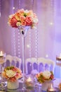 Table set with candles and flowers for a festive event, party or wedding reception Royalty Free Stock Photo