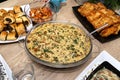 The table is set before Christmas dinner in Poland, visible baked cod fillets in chanterelle sauce.