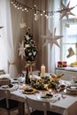 A table set for dinner meal at Christmas time. Royalty Free Stock Photo