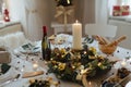 A table set for dinner meal at Christmas time. Royalty Free Stock Photo