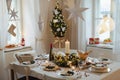 A table set for dinner meal at Christmas time. Royalty Free Stock Photo