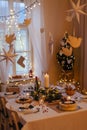 A table set for dinner meal at Christmas time. Royalty Free Stock Photo