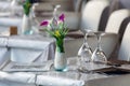 Table set with flowers, glasses, napkins and forks Royalty Free Stock Photo