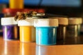 On the table is a set of gouaches in jars and brushes Royalty Free Stock Photo