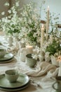 A table set with plates, cups and candles Royalty Free Stock Photo