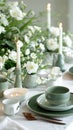 A table set with plates, cups, saucers and candles
