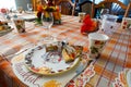 Table set for thanksgiving dinner with decorative paper plates, napkins and cups