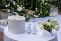 A table set up for a wedding reception with white flowers and candles Royalty Free Stock Photo