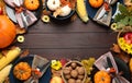 Table setting with autumn vegetables and fruits on wooden background, flat lay. Thanksgiving day celebration Royalty Free Stock Photo