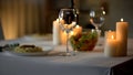 Table setting background, dinner and burning candles, celebration in restaurant