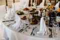 Table setting for a banquet or holiday. Empty glasses for spirits, champagne and juice. Cold appetizers and salads