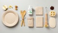 Table setting with a beige compostable paper plate and bamboo cutlery Royalty Free Stock Photo