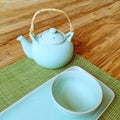 Table setting and blue teapot Royalty Free Stock Photo