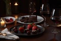 table setting with chocolate-covered strawberries, glass of red wine, and plate of assorted desserts