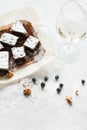 Table setting, chocolate dessert brownie cake with berries on pa Royalty Free Stock Photo