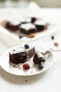 Table setting, chocolate dessert brownie cake with berries on a Royalty Free Stock Photo