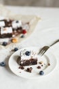 Table setting, chocolate dessert brownie cake with berries Royalty Free Stock Photo