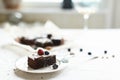 Table setting, chocolate dessert brownie cake with berries on a Royalty Free Stock Photo