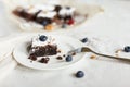 Table setting, chocolate dessert brownie cake with berries on a Royalty Free Stock Photo