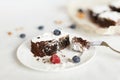 Table setting, chocolate dessert brownie cake with berries on a Royalty Free Stock Photo