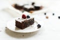 Table setting, chocolate dessert brownie cake with berries on a Royalty Free Stock Photo