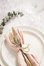 Table setting details on white plates. Royalty Free Stock Photo