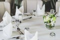 Table setting for dining room, the table is decorated with flowers,Fine table setting in a luxurious restaurant Royalty Free Stock Photo