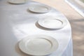 Table setting element empty plates with cutlery on white tablecloth Royalty Free Stock Photo