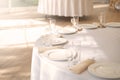 Table setting element empty plates with cutlery on white tablecloth Royalty Free Stock Photo
