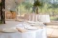 Table setting element empty plates with cutlery on white tablecloth Royalty Free Stock Photo