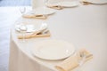 Table setting element empty plates with cutlery on white tablecloth Royalty Free Stock Photo