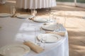 Table setting element empty plates with cutlery on white tablecloth Royalty Free Stock Photo