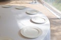 Table setting element empty plates with cutlery on white tablecloth Royalty Free Stock Photo