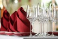 Table setting with empty glasses, plates and cutlery