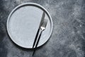 Table setting. Empty plate, knife, fork and napkin. Top view and flat lay with copy space Royalty Free Stock Photo