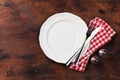 Table setting. Empty plate, knife, fork, spices and napkin. Top view and flat lay with copy space Royalty Free Stock Photo