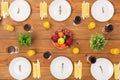 Table setting for family dinner on wooden surface