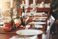 Table setting, fine dining and celebration of Christmas dinner on a patio of a house. Food, party and dining table ready Royalty Free Stock Photo