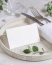 Table setting with folded card decorated with eucalyptus branches close up, Wedding mockup Royalty Free Stock Photo