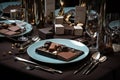 table setting with gourmet chocolate bars, cutlery, and glassware for elegant dessert