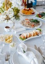 Table setting with light fish and meat snacks Royalty Free Stock Photo